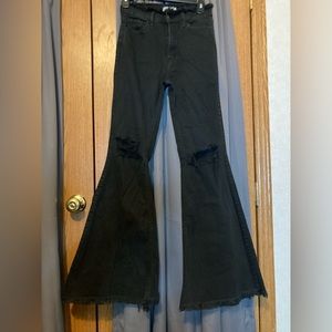 Black flared ripped jeans.